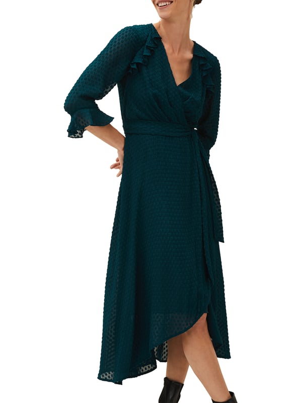 The Lilibeth Wrap Midi Dress in Ocean Blue offers timeless elegance with a modern twist, perfect for any casual occasion.