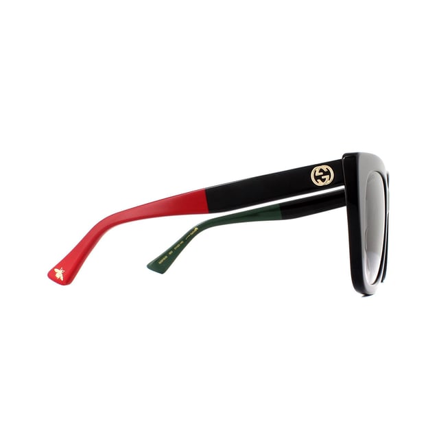 Gucci Sunglasses GG0163S 003 Black with Red and Green Brown Gradient are a sophisticated square cat eye style crafted from thick acetate. Temples feature the Gucci interlocking GG logo as well as the bumblebee motif at the temple tips.