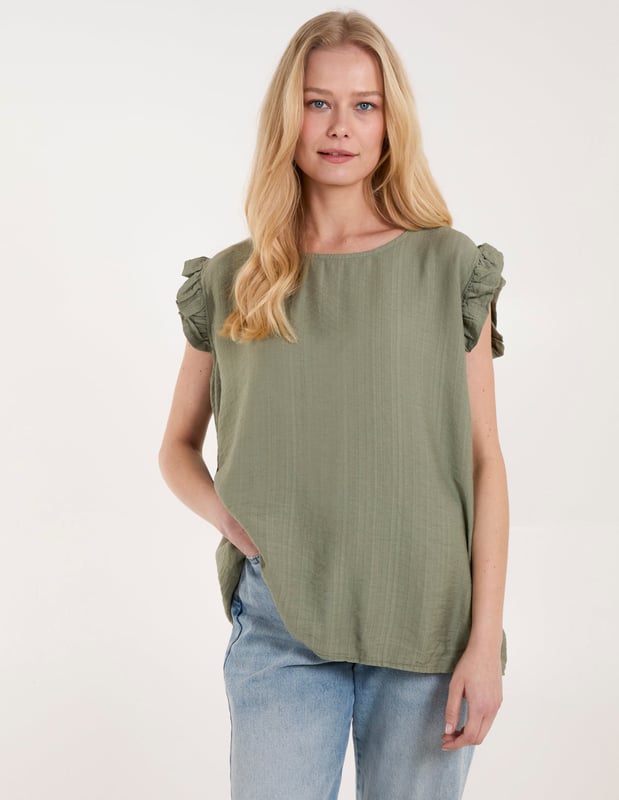 Go for comfort this summer with this Button Back Frill Shoulder Top. Pair with jeans, strappy heels and a headband for an easy day to night look!