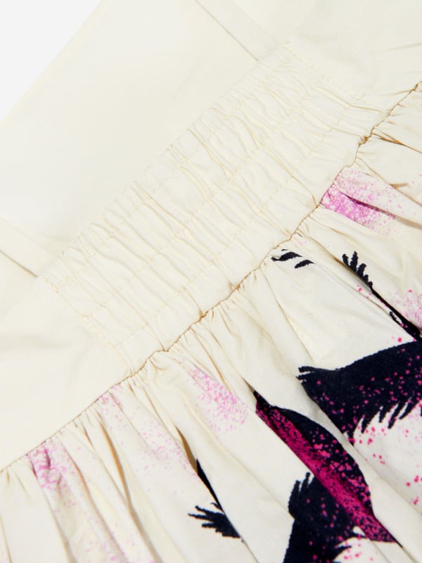 Molo inject passion and an eccentric outlook into their aesthetics. This girls twilight dress is reflective of the label's ostentatious technological properties. Crafted in a strapless off-white organic cotton design showcasing a print of a deserted island in shades of purple, pink and black that are reminiscent of a Hawaiian summer.‚ Empire Waist‚ Full Skirt‚ Narrow Straps‚ Hidden Zipper At Side Seam ‚ 100% Organic Cotton‚ GOTS Organic Certified By Ecocert Greenlif