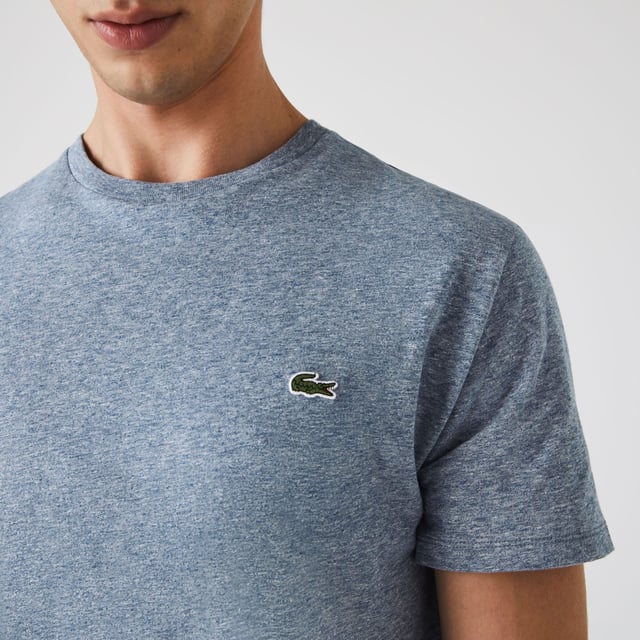 Mens Lacoste Crew Neck Pima Cotton Jersey T-Shirt in blue.- Ribbed crew neck.- Short sleeves.- Embroidered Lacoste logo at left chest.- Tonal back neck tape.- Super soft pima cotton jersey fabric.- Regular fit.- 100% Cotton.  - Ref: TH6709-1GF