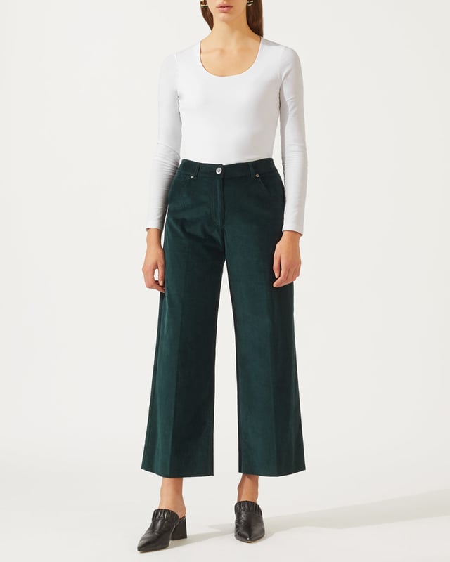 This versatile long sleeved top is made from a soft stretch jersey. Styled with a flattering scoop neck and double-layer front for a flattering finish, we recommend layering this key capsule piece under a jacket for the office, or team with jeans for an easy weekend look.