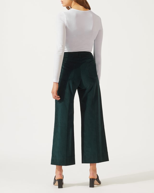This versatile long sleeved top is made from a soft stretch jersey. Styled with a flattering scoop neck and double-layer front for a flattering finish, we recommend layering this key capsule piece under a jacket for the office, or team with jeans for an easy weekend look.