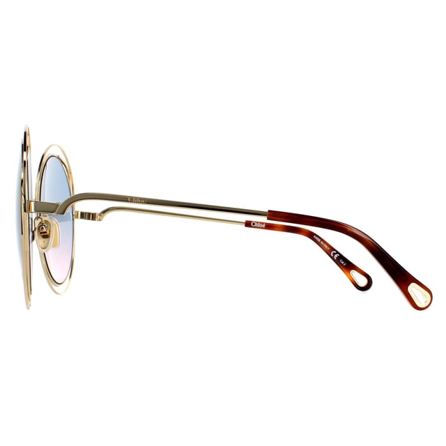 Chloe Round Womens Goudblauw roze gradiënt Ch0045S Zonnebril zijn een oversized ronde stijl met een sculpturaal bekabeld frame, siliconenneuspoten en tempels geëtst met het Chloe -logo.