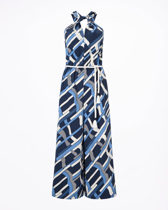 This jumpsuit features an exclusive modern Jigsaw print, hand-drawn by our in-house artist as a modern take on a check. Styled with a wide leg, it has a twist design at the neck and a rope tie at waist for a playful finish. Pair with heels for summer evenings out.
