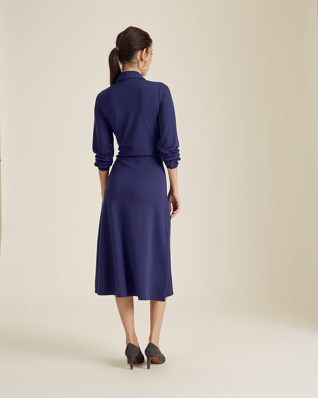 A new shape for Autumn Winter 19, this jersey dress has a shirt style upper and a fluid skirt. Designed with long sleeves, it has a front tie detail on the hips to create a feminine silhouette. Dress it up with our Daphine knee high boots or wear casually with leather trainers.