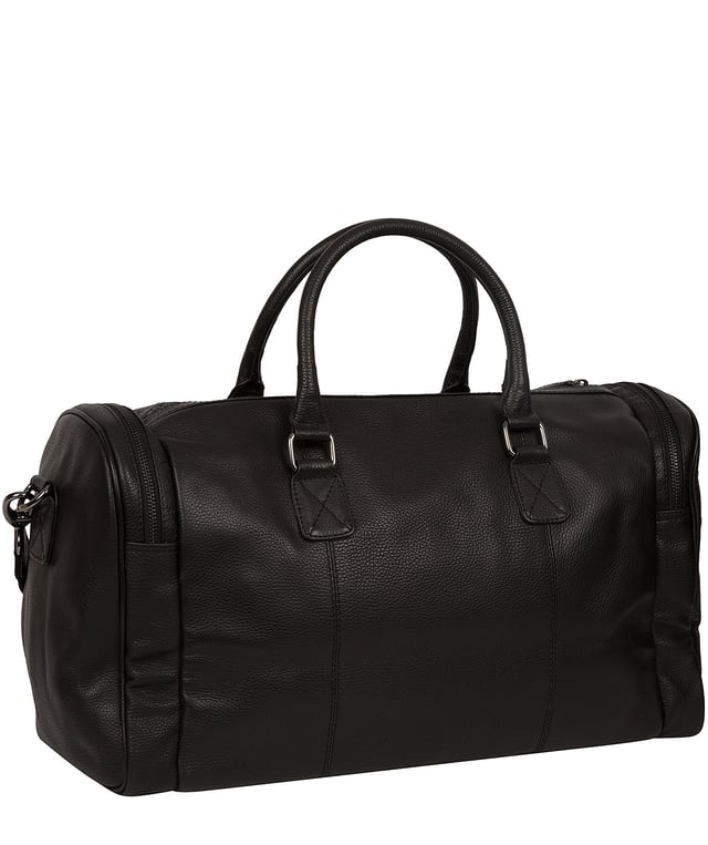 Crafted from natural leather with a supple and ultra-soft feel, the 'Ocean' holdall from Cultured London is the perfect bag for a when travel is on the agenda. The zip-over top secures the main compartment, concealing the 100% natural cotton lining. Two outer zipped pockets provide extra storage solutions, complemented by metal fittings. Comes with matching leather grab handles and an adjustable strap with a drop length of 70cm. Finished with the contemporary embossed Cultured London logo.