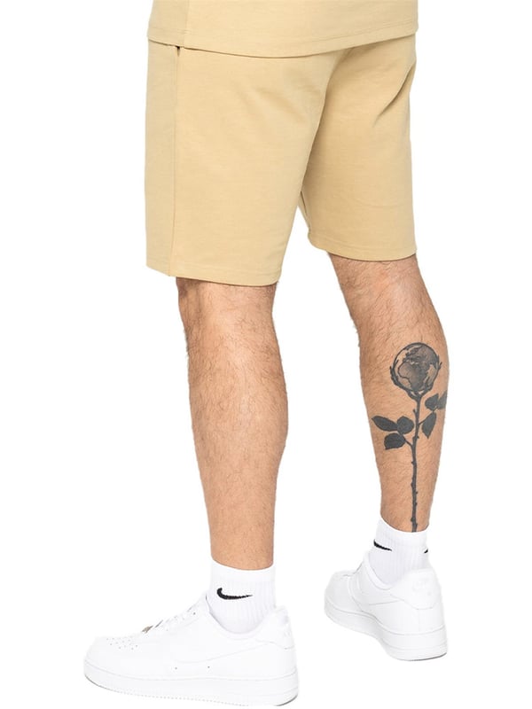 Enzo Mens Casual Stretch Shorts offer comfort and convenience with 2 side & 2 back pockets, elastic waistband & adjustable drawstring, and front pin tuck seam detail for added style and functionality. Perfect for errands or lounging with a practical and stylish design.