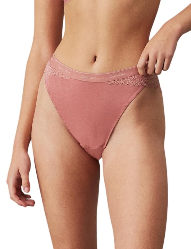 Calvin Klein Modern Lace Tanga Treat yourself to some new designer pieces such as the Calvin Klein Modern Lace tanga brief. With its high waistline and leg rise, this brief offers just the right amount of coverage and shows off your beautiful curves. The lace sides and back add a touch of femininity and elegance, making you feel effortlessly alluring. But don't let the delicate lace fool you, the smooth opaque front provides ultimate comfort and ensures a seamless look under any outfit. As a signature of Calvin Klein, the waistband features the iconic logo, elevating this tanga brief to be more than just a piece of lingerie, but a fashion statement. And with cheeky rear coverage, you'll feel just the right amount of playful and flirty. Complete the set with matching coordinates, available with the same alluring lace and signature waistband today!
Tanga brief
High-rise waist
High leg rise
Lace sides and back
Smooth opaque front
Calvin Klein signature waistband
Cheeky rear coverage
Matching coordinates available
Country of origin: Indonesia
Composition: 80% Nylon | 20% Elastane
Listed in UK sizes
Tanga Brief