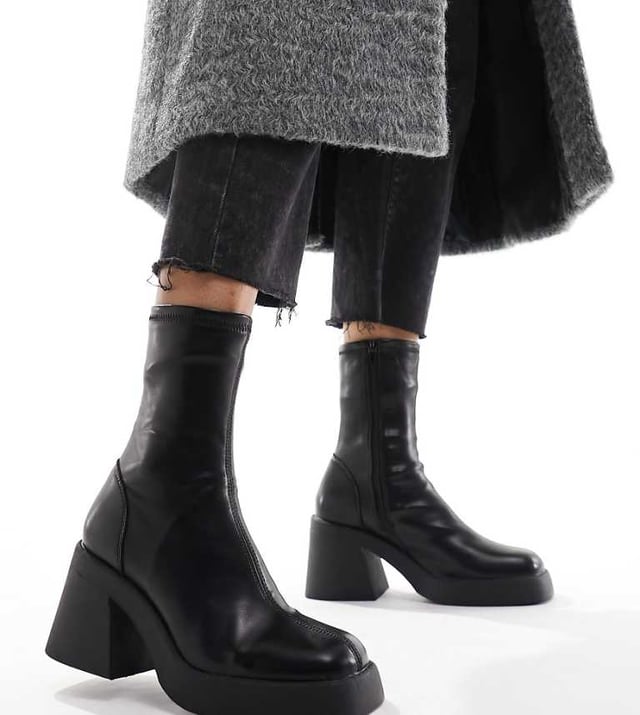 Shoes by ASOS DESIGN Reboot in progress Zip-side fastening Sock-like cuff Square toe Chunky sole Mid block heel Wide fitSold By: Asos