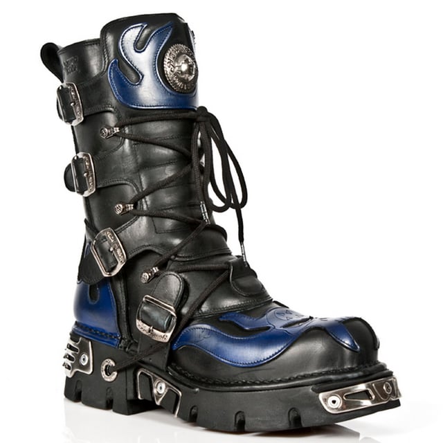 These mid-calf boots are crafted from premium cow hide leather and are finished with a quality that reflects the decades of experience in crafting premium footwear that New Rock has proudly amassed. This pair is characterised by a bold skull art piece and flame design that appears in blue on the black leather upper for a striking unique look that is sure to stand you out from the crowd. Another addition to the shoes distinctive look is a metallic motif that is created by the introduction of metal buckles, metallic inserts in the soles and an elegantly designed shiny New Rock logo. Not only is this a stunningly trendy piece but with the addition of a soft cushioned insole, comfortable leather lining and side zip opening these boots reach a level of comfort that will make you want to keep these mid-calves on all day.• Premium black leather uppers with blue skull feature• 23cm shaft height with side zip and metal buckles• 6cm rubber heel and 3cm sole