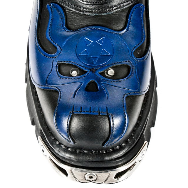 These mid-calf boots are crafted from premium cow hide leather and are finished with a quality that reflects the decades of experience in crafting premium footwear that New Rock has proudly amassed. This pair is characterised by a bold skull art piece and flame design that appears in blue on the black leather upper for a striking unique look that is sure to stand you out from the crowd. Another addition to the shoes distinctive look is a metallic motif that is created by the introduction of metal buckles, metallic inserts in the soles and an elegantly designed shiny New Rock logo. Not only is this a stunningly trendy piece but with the addition of a soft cushioned insole, comfortable leather lining and side zip opening these boots reach a level of comfort that will make you want to keep these mid-calves on all day.• Premium black leather uppers with blue skull feature• 23cm shaft height with side zip and metal buckles• 6cm rubber heel and 3cm sole