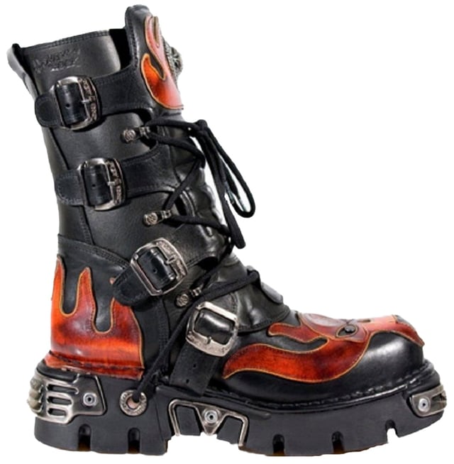 These mid-calf boots are crafted from premium cow hide leather and are finished with a quality that reflects the decades of experience in crafting premium footwear that New Rock has proudly amassed. This pair is characterised by a bold skull art piece and flame design that appears in red on the black leather upper for a striking unique look that is sure to stand you out from the crowd. Another addition to the shoes distinctive look is a metallic motif that is created by the introduction of metal buckles, metallic inserts in the soles and an elegantly designed shiny New Rock logo. Not only is this a stunningly trendy piece but with the addition of a soft cushioned insole, comfortable leather lining and side zip opening these boots reach a level of comfort that will make you want to keep these mid-calves on all day.• Premium black leather uppers with red skull feature• 23cm shaft height with side zip and metal buckles• 6cm rubber heel and 3cm sole