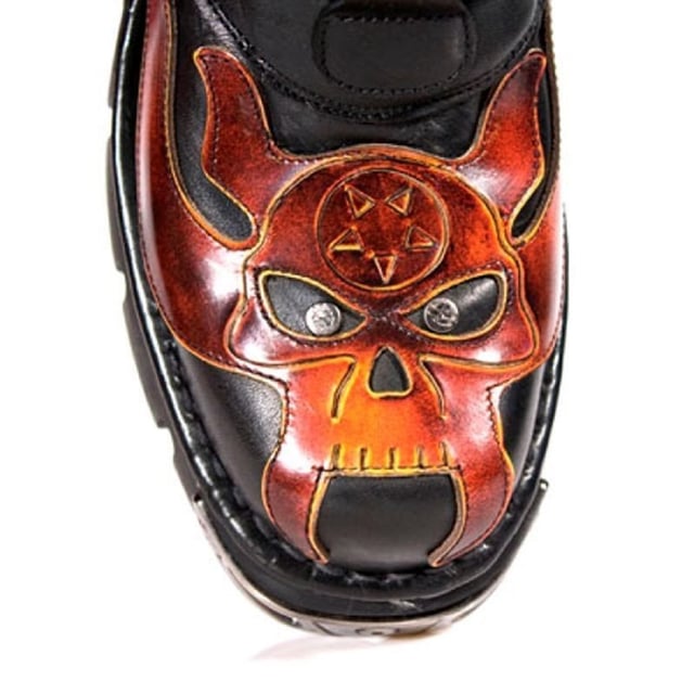 These mid-calf boots are crafted from premium cow hide leather and are finished with a quality that reflects the decades of experience in crafting premium footwear that New Rock has proudly amassed. This pair is characterised by a bold skull art piece and flame design that appears in red on the black leather upper for a striking unique look that is sure to stand you out from the crowd. Another addition to the shoes distinctive look is a metallic motif that is created by the introduction of metal buckles, metallic inserts in the soles and an elegantly designed shiny New Rock logo. Not only is this a stunningly trendy piece but with the addition of a soft cushioned insole, comfortable leather lining and side zip opening these boots reach a level of comfort that will make you want to keep these mid-calves on all day.• Premium black leather uppers with red skull feature• 23cm shaft height with side zip and metal buckles• 6cm rubber heel and 3cm sole