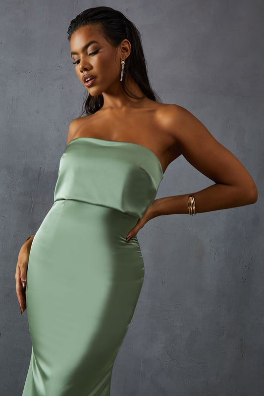 Elegant bandeau neckline with overlay detail
        Figure-hugging silhouette for a flattering fit
        Floor-length design perfect for formal occasions
        Luxurious satin fabric for a sophisticated look
        Sleek, strapless style to showcase your shoulders
    
    Make a striking entrance at your next formal event with this stunning bandeau overlay bridesmaid dress from MissPap. The sleek, strapless design features an elegant overlay detail that adds a touch of sophistication to the classic silhouette. The figure-hugging cut accentuates your curves, while the floor-length style ensures a dramatic sweep as you move. Perfect for weddings, galas, or any black-tie affair, this dress is versatile enough to be styled for various occasions. Pair it with strappy heels and statement earrings for a glamorous look, or opt for a delicate necklace and understated clutch for a more refined ensemble. The luxurious satin fabric catches the light beautifully, ensuring you'll shine throughout the evening. Whether you're a bridesmaid or a guest, this dress is sure to turn heads and make you feel like the belle of the ball.