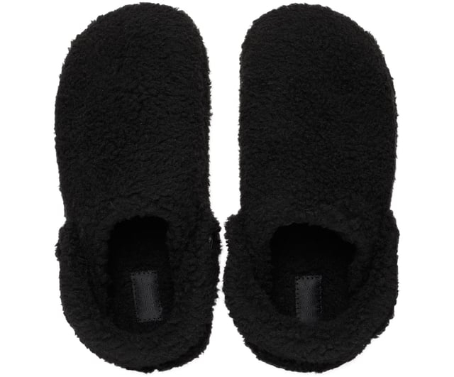 Embrace Ultimate Comfort with Classic Cozzzy Slipper inspired by the iconic Crocs Classic Clog design. Features cozy faux shearling fuzz from heel to toe, with a signature backstrap for secure fit. Enjoy soft, sink-in comfort with cushioned footbeds and a durable rubber outsole for traction.