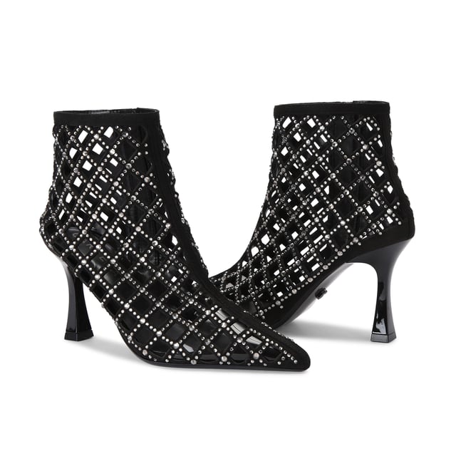This Carvela Ankle Boot features a black microsuede upper with cut out details and silver crystals across the upper. The toe is pointed with an interior smoked lining and the heel is flared in design. Heel height: 8.5cm.