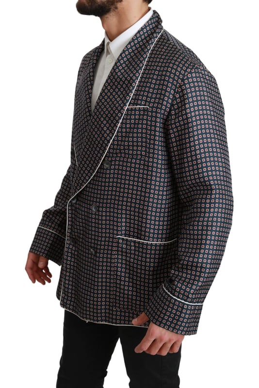 Merk: Dolce & Gabbana
  Stijl: jas met dubbele rij knopen
  Kleur: Marineblauw met patroon
  Sluiting: Knoop
  Pasvorm: Normale pasvorm
  Drie buitenzakken
  Logo details
  Vervaardigd in Italie
  Materiaal: 100% Zijde
  Voering: 100% Zijde
