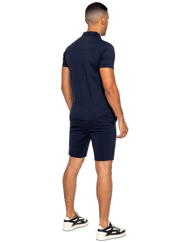 Enzo Mens Collared Polo Tracksuit Set. Collared, ¼ Zip, Short Sleeve Polo. Stitched Trims At Sleeve & Hem. Stretch Fabric For Extra Comfort. Finished with Stretch Shorts. 2 Side Pockets, 2 Back Welt Pockets. Elasticated Waistband With Adjustable Drawstring. Front Pin Tuck Seam