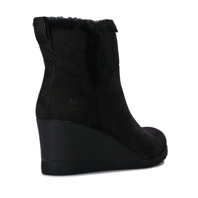 Womens UGG Australia Devorah Boots in black.<BR><BR>- Waterproof suede upper with seam-sealed construction.<BR>- Almond shaped toe.<BR>- Pull-on loop for easy on-off.<BR>- Soft sheepskin lining.<BR>- UGGpure wool insole.<BR>- Wedge heel.<BR>- Flexible White Spider Rubber outsole.<BR>- Debossed UGG branding to side.<BR>- Wedge height: 2.5in approximately.<BR>- Shaft height: 4.5in approximately.<BR>- Suede upper  Textile lining  Rubber sole.<BR>- Ref: 1103824<BR><BR>Measurements are intended for guidance only.<BR><BR>We sell genuine UGG® boots.  These are only available in half sizes.  Therefore if you were to order a size 5 we shall send you a 5.5 which we know from experience will be the best fit.