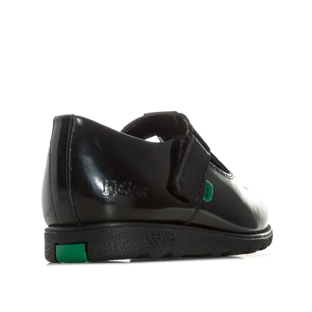 Junior Girls Kickers Fragma T-Bar Patent Shoes in Black<BR><BR>- T-bar construction<BR>- Hook and loop strap fastening<BR>- Classic triple stitch detail<BR>- Iconic red and green logo tabs<BR>- Shiny leather patent upper<BR>- Branding embossed to side<BR>- Leather Upper  textile and Synthetic Lining  Synthetic Sole<BR>- Ref: 115177