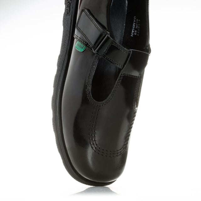 Junior Girls Kickers Fragma T-Bar Patent Shoes in Black<BR><BR>- T-bar construction<BR>- Hook and loop strap fastening<BR>- Classic triple stitch detail<BR>- Iconic red and green logo tabs<BR>- Shiny leather patent upper<BR>- Branding embossed to side<BR>- Leather Upper  textile and Synthetic Lining  Synthetic Sole<BR>- Ref: 115177