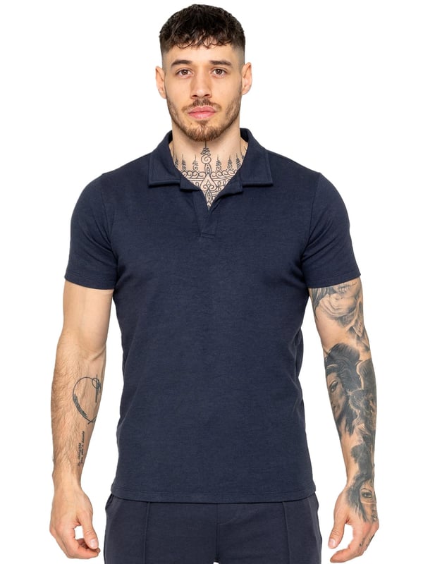 Upgrade your summer wardrobe with the Enzo Milano Short Sleeve Polo Shirt. Made from premium quality fabric, this polo shirt ensures both comfort and durability. Designed with a straight hem for a clean and polished finish, it features an open collar that elevates its appearance to a refined, premium level. Ideal for adding a touch of sophistication to any outfit, this Regular Fit polo shirt comes with a convenient zip fastening.