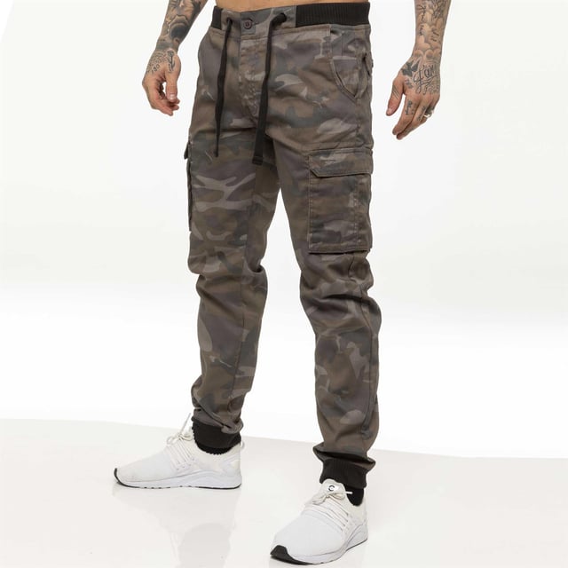 Enzo Men’s Camo Combat Cuffed Jogger Style Trousers in Grey, 65% Polyester, 35% Cotton, Elasticated Waist with Drawcord and Secured by Button, Mid Rise, Elasticated Ribbed Waist and Cuffs, 2 Front Pockets, 2 Buttoned Back Pockets and 2 Velcro Side Pockets, Zip Fly Fastening, Machine washable, Suitable For All Year Round Wear And Casual Occasions.