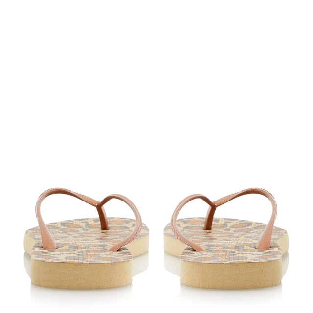 Create a glam beachside look in Havaianas' snake print design. Black, lilac and rose with metallic straps and slight wedge sole. Made in Brazil with non-slip finish, heat and water resistant.