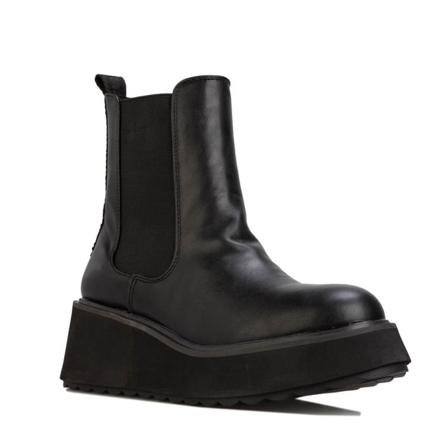 Botas altas Rocket Dog negras para mujer, confeccionadas en sintético y suela sintética. Características: altura de tacón 6 cm, forro textil, tirador en el talón, refuerzo elástico y tacón cuadrado.