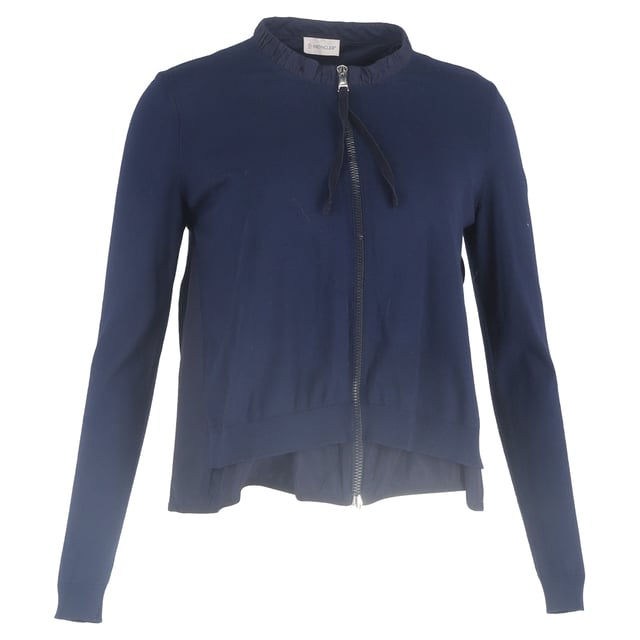 VINTAGE, RRP AS NEW
Add a touch of feminine sophistication to your wardrobe with the Moncler Ruffled Collar Zipped Cardigan in navy blue wool. This luxurious cardigan combines modern design with classic comfort, crafted from soft, breathable wool that provides warmth and a cozy feel, while the rich navy blue hue offers timeless versatility.

 Moncler Ruffled Collar Zipped Cardigan in Navy Blue Wool

Condition: Excellent
Signs of wear: No retail tag but Brand tag on., No visible sign of wear., 
Packaging: None
Color: Blue | navy blue
Material: Wool
Size: INT | L/UK14/IT46/US10/FR42
Measurements: Length: 550
SKU: NAPPUGBCL444354W