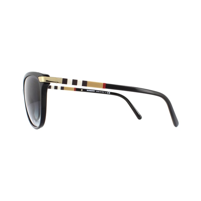 Burberry Sunglasses BE4216 30018G Black With Gold Detailing Grey Gradient are a classy and easy to wear cat eye style for women. Made from slimline acetate with contrasting metal detailing at the hinges, they have a truly luxurious feel. The iconic Burberry check can be found along the temples to authenticate and provide instant brand recognition.