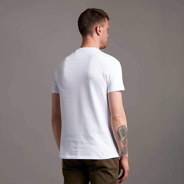 Crafted from 100% cotton from unrivalled softness, the Lyle & Scott Plain T-Shirt is an iconic style and the definition of a wardrobe staple. Featuring a classic silhouette, detail stitching at collar and cuff, plus our signature Golden Eagle, this t-shirt can be seamlessly layered or stand alone as the centrepiece of any smart-casual outfit.  
  
Fit: Regular
It is crafted to fit the body neither too tightly or too loosely, leaving you with a classic, timelessly stylish look. We recommend you order your usual size, but if you're caught between two, go a size up.
