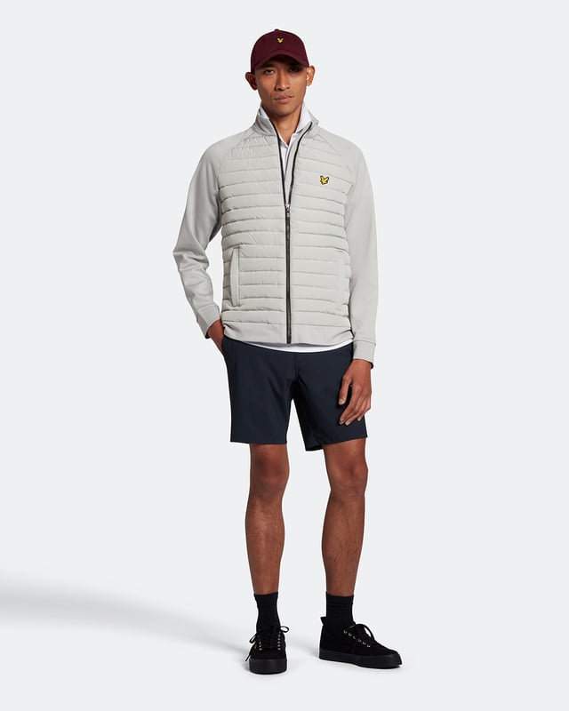 The Lyle &amp; Scott golf tech polo shirt. This regular-fit polo, is made from a recycled polyester blend and designed to be as lightweight as possible, with a three-button placket &amp; detail stitching on the collar and cuff.