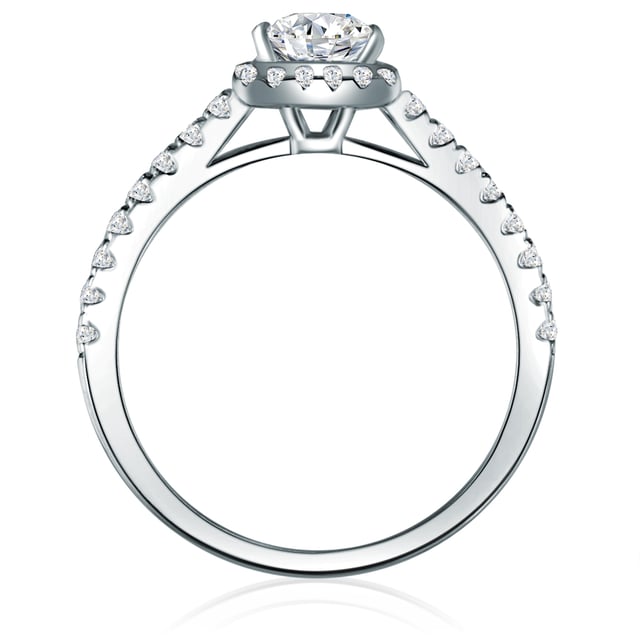 If you love glamor, you cannot resist this exclusive engagement ring: the Entouragering of the Manufaktur Surry 1934 enchants with the elegant ensemble of a narrow ring rail, crowned by a glittering gem in pavé frame. The semi-occupied ring rail made of rhodium-plated 925 sterling silver is densely occupied with small jewelry, which, as a Halo wreath, close around the angular zirconia solitary in the brilliant cut and impressively bring it into its own. The result is an incomparable sparkle at the hand of your loved ones and is guaranteed to make your application an unforgettable experience!