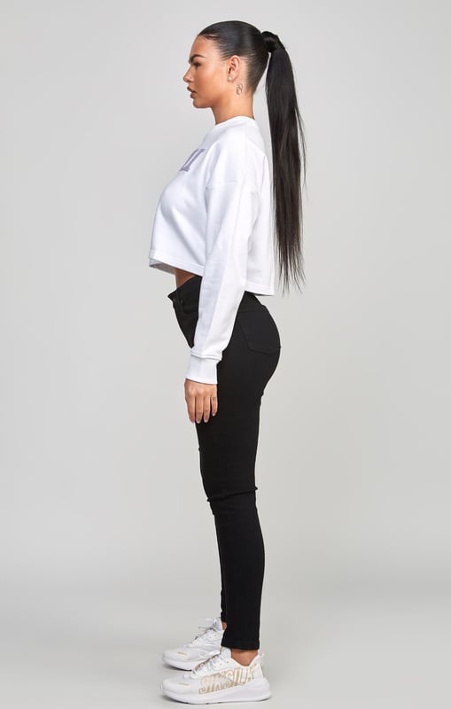 inchWhite Crop Varsity SweatshirtSoft touch fabricCropped fitEmbroidered logoCrew neckAppliqueLong sleeveMachine wash80% Cotton 20% Polyester Loopback inch
