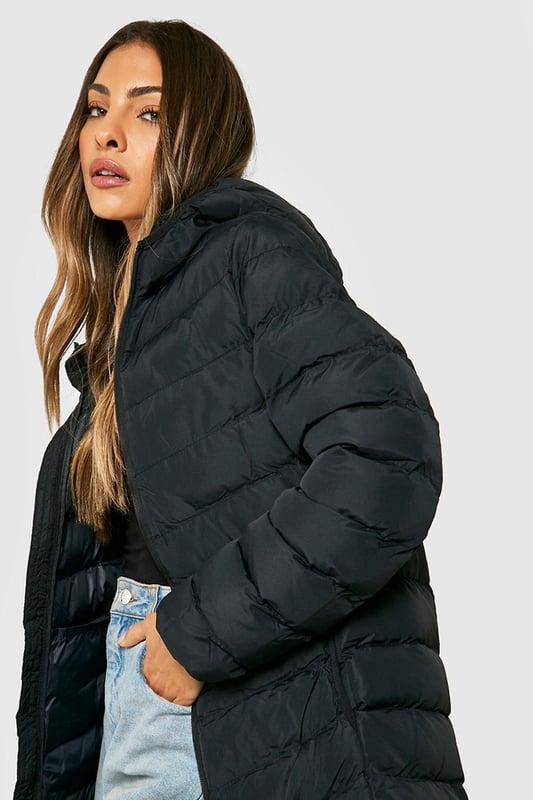 Feeling the chill? Featuring a padded design which is perfect for the colder months, a puffer jacket is the winter staple you need in your life. Warm yet lightweight, a padded jacket has a signature quilted design that's perfect for keeping cosy and insulated all winter. Pair with your fave split-hem jeans and box-fresh trainers and your go-to street style is sorted. If it's extra cold, layer over your fave loungewear set for all the cosy vibes.Style: Puffer JacketFabric: PolyesterLength: LonglineNeckline: HoodedSleeve Length: Long Sleeve