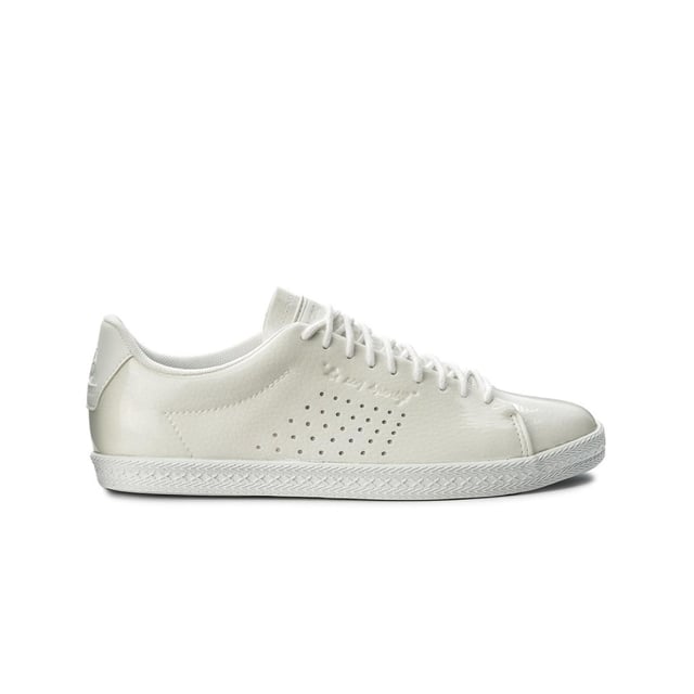 Le Coq Sportif Charline Women's White Trainers – a classic and versatile footwear choice that brings a touch of elegance and simplicity to your casual wardrobe. With their clean white color, timeless design, and comfortable features, these trainers are ready to add a touch of understated charm to your everyday look.

Key Features: 

 Clean White Color:  The Le Coq Sportif Charline Trainers come in a clean white color that offers a timeless and neutral look, making them easy to pair with various outfits.

  Classic Design:  These trainers feature a classic design with minimalistic details, providing an elegant and fashionable touch to your style.

Premium Materials:  Many Charline models are crafted from premium materials, ensuring durability and a quality finish.

 Logo Detailing:  The trainers often feature Le Coq Sportif branding and logo details, showcasing the brand's heritage and craftsmanship.

 Comfortable Fit:  Designed with comfort in mind, these trainers offer a comfortable fit suitable for everyday wear and light activities.

 Lace-Up Closure:  With a lace-up closure, these trainers provide a customizable fit that ensures security during casual wear.

 Cushioned Insole:  Many models incorporate a cushioned insole, offering a soft and comfortable feel underfoot.

 Versatile Styling:  The Charline Trainers can be styled in various ways, from casual streetwear to clean and minimalist outfits.

 Timeless Elegance:  Le Coq Sportif is known for its timeless and classic designs, and the Charline series embodies that sense of elegance and simplicity.