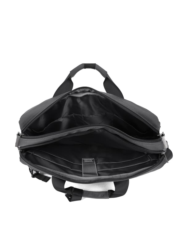 Bolso unisex. El cierre es con cremallera. Los bolsillos internos son bolsillos multifuncionales. Los bolsillos externos son dos delanteros con cremallera y uno trasero con cremallera. La bandolera es ajustable y extraíble en tejido. El asa es de tela. Hay tres compartimentos internos. El material exterior es poliéster. Internamente está forrado en poliéster. Medidas: 40,5x10x29 cm. Producto de moda