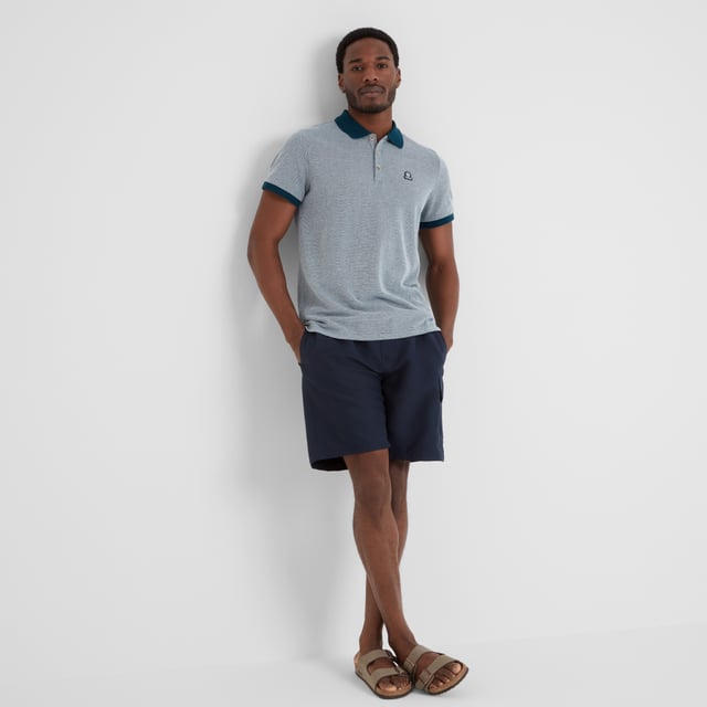 Whitley Mens Polo Shirt - Deep Sea Blue Made from comfy and sustainable cotton, TOG24's Whitley pique polo shirt effortlessly blends style with comfort. This polo shirt features branded buttons for an interesting touch of design flair and is made with ribbed cuffs and a ribbed collar for ease of wear.