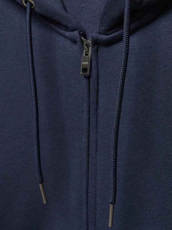 Der Kruze Mens Zip Up Hoodie ist ein hochwertiges Trainingsanzug-Set, das von Enzo entworfen wurde. Dieser Kapuzenpullover mit normaler Passform und Reißverschluss verfügt über Kängurutaschen und Bündchen an den Ärmeln, gepaart mit passenden Jogginghosen. Der elastische Bund und der verstellbare Kordelzug sind für ultimativen Komfort mit einem gebürsteten Innenfleece versehen. 52 % Baumwolle, 48 % Polyester. Erhältlich in den Farben Schwarz, Grau und Marineblau.