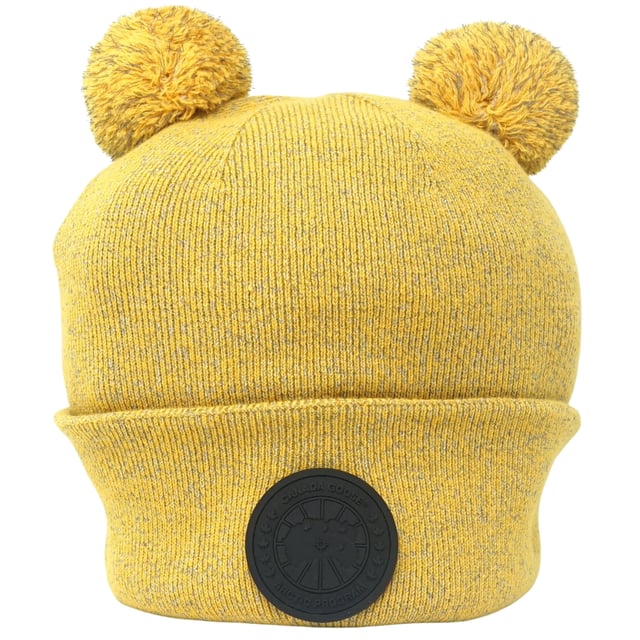 Canada Goose X Angel Chen Double Pom Toque Yelllow Beanie. This Canada Goose Logo yellow Beanie will keep you warm and stylish all season. Featuring a double pom and brand logo, it's perfect for adding a stylish touch to any winter look. Stay fashionable and cozy!. 100% Wool, Made In Italy. Stretching Fit, Angel Chen Collection, Beanie Hat. Regular Fit, Fits True To Size. Style: 8820LC 1039
