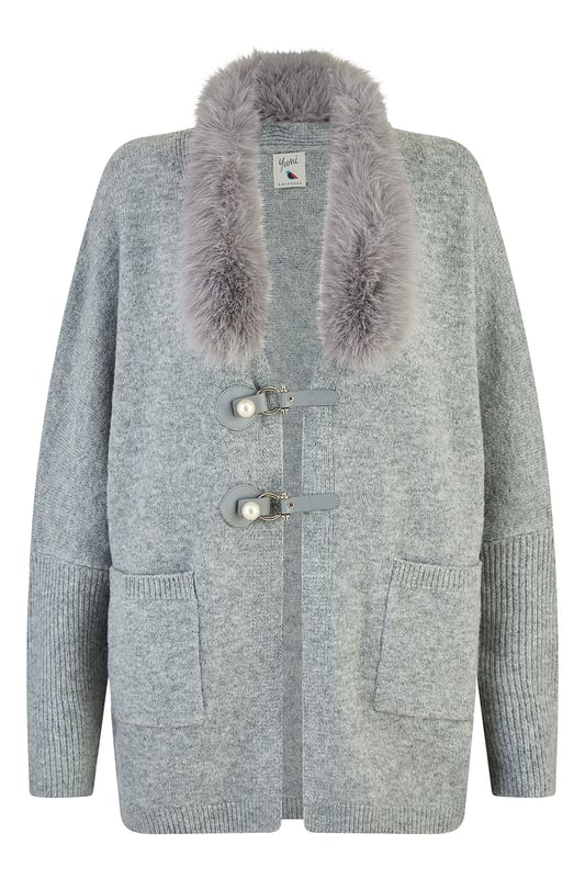 This cute cardi is perfect for cosying up this winter - In a soft marl knit with buckle fastening in the front and faux fur detachable collar. Style with jeans and a roll neck jumper - With boots or trainers for a casual off duty look.