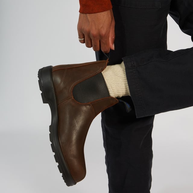 Built to weather the elements, the Blundstone 1477 boots are unmatched as temperatures begin to fall. With fully waterproof premium antique brown leather uppers, these boots will ensure your feet are nice and dry, whether it's snowing, raining or anything in between. In addition, the genuine removable shearling sheepskin footbed is supremely comfortable and with Blundstone's Thinsulate lining throughout the boot, it will help to keep your feet toasty and dry. These added cold-weather features come with the unrivalled comfort, durability and style that you have come to expect from Blundstone boots, with durable TPU outsole for enhanced traction on slippery terrains, and the patented SPS Max Comfort system for reduced wearer fatigue and increased comfort.A staple for any cold-weather wardrobe, winter is no match for the Blundstone 1477 thermal boots.  Premium antique brown waterproof leather uppers Waterproof brown elasticated sides and iconic pull tags for easy slip-on Latexed seams to ensure waterproofing Thermal Thinsulate® insulation for warmth Removable shearling sheepskin footbed Highly durable TPU outsole ensures excellent traction on all terrains and outstanding durability Blundstone SPS Max Comfort system for superb comfort Lightweight and comfortable