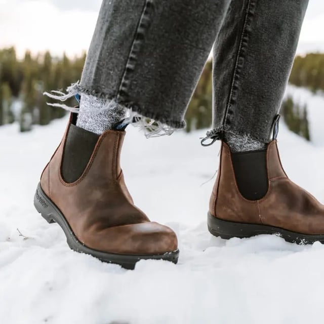 Built to weather the elements, the Blundstone 1477 boots are unmatched as temperatures begin to fall. With fully waterproof premium antique brown leather uppers, these boots will ensure your feet are nice and dry, whether it's snowing, raining or anything in between. In addition, the genuine removable shearling sheepskin footbed is supremely comfortable and with Blundstone's Thinsulate lining throughout the boot, it will help to keep your feet toasty and dry. These added cold-weather features come with the unrivalled comfort, durability and style that you have come to expect from Blundstone boots, with durable TPU outsole for enhanced traction on slippery terrains, and the patented SPS Max Comfort system for reduced wearer fatigue and increased comfort.A staple for any cold-weather wardrobe, winter is no match for the Blundstone 1477 thermal boots.  Premium antique brown waterproof leather uppers Waterproof brown elasticated sides and iconic pull tags for easy slip-on Latexed seams to ensure waterproofing Thermal Thinsulate® insulation for warmth Removable shearling sheepskin footbed Highly durable TPU outsole ensures excellent traction on all terrains and outstanding durability Blundstone SPS Max Comfort system for superb comfort Lightweight and comfortable