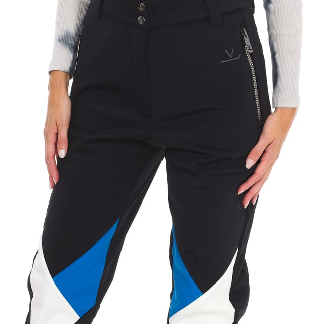 Ski pants Vuarnet.
 Front opening with zipper and snap button.
 Two zippered hand pockets
 Adjustable lower leg with zipper.
 Fixed inner gaiter with non-slip bands and reinforced material on the leg.
 Brand logo on the back.
 Seams seen in tone.
 Composition: 76% Polyamide, 24% Elastane
 Care:
Handwash.
 Do not use dryer.
 Do not iron.
 Do not use bleach.
 Do not dry clean.