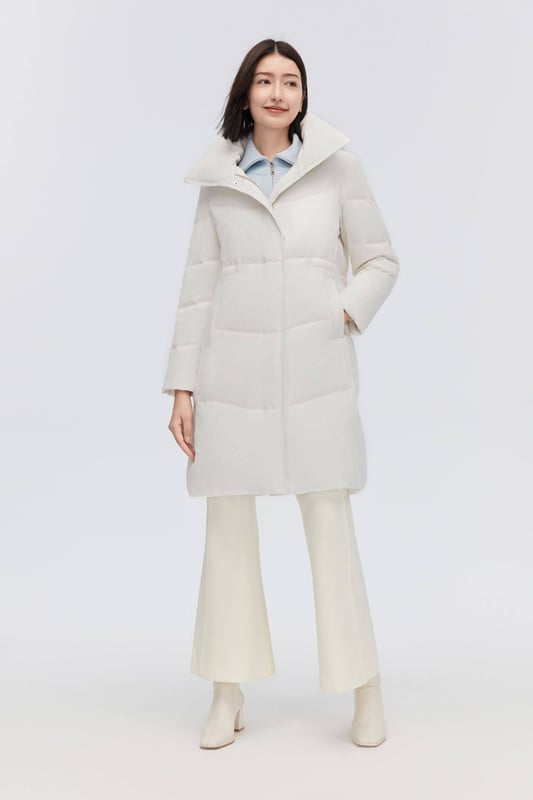 Crafted from smooth tech fabric, this lightweight coat offers windproof protection, stretchy inserts for freedom, and an adjustable drawstring waist.