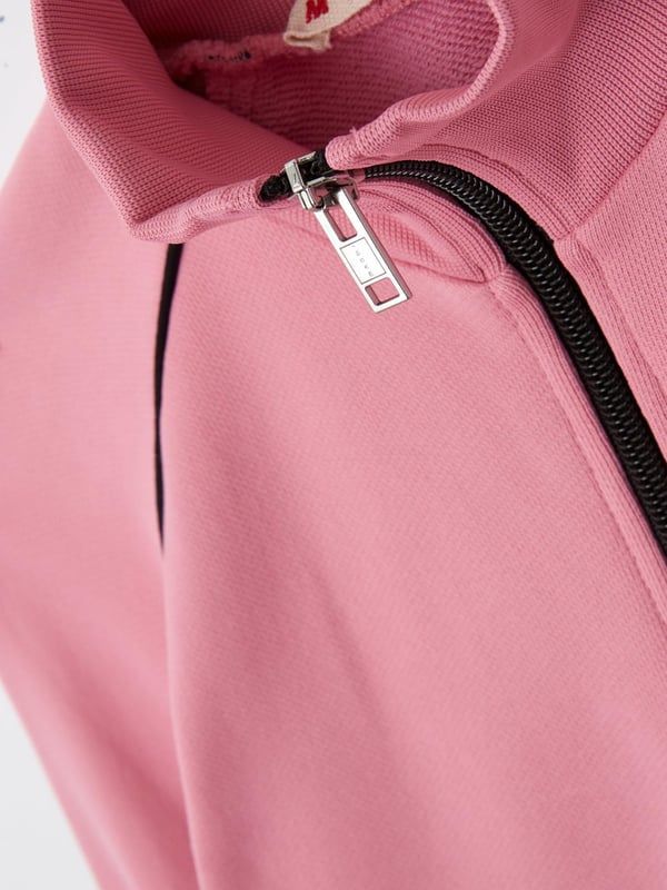 • 95% Polyester 5% Elastane Double Brushed Cozy Jersey • Features contrasting Marni branding to the front. High neck. Centre front zip closure. Stretchy trim to the neckline, cuffs and hemline