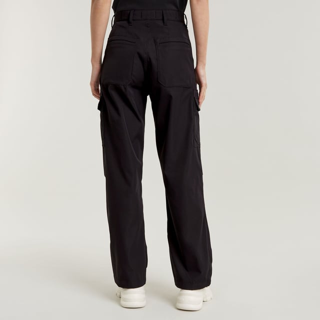 Zip fly. Inset pockets. Welt pockets at the back. Thigh pockets with additional flap pockets on top, snap buttons. Key ring at one of the thigh pockets. Zip & button closure. Ultra-high waist. Cargo pants High Waist are designed in a straight fit and offer an ultra-high waist. Pleats at the outer leg add more shape to this design. The pockets at the thigh show additional flap pockets on top. A key ring is added to one side. 65% Polyester (Recycled), 35% Elastomultiester. Comfortable stretch. Straight