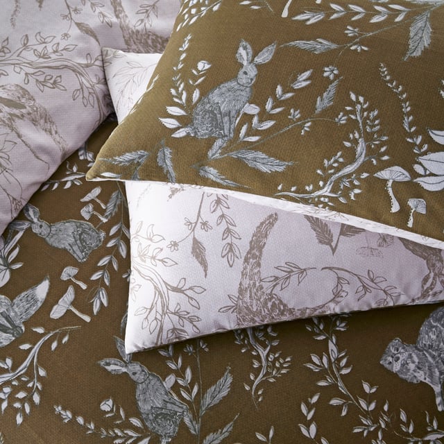 Explore our cosy and delicate take on the beauty of woodland creatures as you rest in the Buckthorn duvet cover set. Hand-drawn rabbits, foxes and bears pose among the delicate florals, which are set on an earth toned background. Flip the set over and the same design appears, but this time in inverted colours, giving you a fresh, evergreen look. An adorable and down to earth addition to your bedroom.
